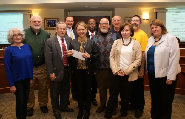 Ewing Green Team presents Ewing Fall Spin proceeds in the amount of a $990 check to HomeFront at December 10, 2019 Ewing Township Council Meeting.